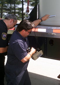 An Inspector from the Public Utilities Commission of Ohio Verifies that Radiation Levels on the First Shipment of Low-Level Radioactive Waste from Fernald's K-65 Silos are Below the Established Department of Transportation (DOT) Standards. The 1/2" Thick Steel Shipping Containers Weigh Approximately 20,000 Pounds When Loaded and Meet all DOT Requirements.
Keywords: Fernald Closure Project Fernald Green Salt Plant, Feed Materials Production Center, Fernald, Ohio (FEMP)