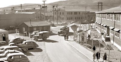 Atomic Boom-town
As a community, Los Alamos was atypical. The population was homogeneous; most people were in their 20s or 30s, healthy, and middle-class. Unemployment did not exist. Despite the informality of the place, it was not, as former resident Ruth Marshak remembered, a caste-less society. Employees' ranking in the Laboratory dictated their social standing as well as the quality of their housing was determined by one's position in the Laboratory.
Keywords: Los Alamos National Lab LANL