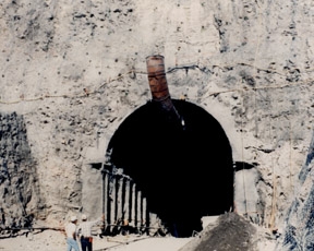 CONSTRUCTION PROGRESS OF EXPLORATORY STUDIES FACILITY STARTER TUNNEL.
YUCCA MOUNTAIN, SOUTHWEST BOUNDARY OF NEVADA TEST SITE, EVALUATED FOR NATION'S FIRST REPOSITORY FOR COMMERCIAL HIGH-LEVEL RADIOACTIVE WASTE. GEOLOGICAL, HYDROLOGICAL & GEOPHYSICAL DATA OBTAINED FROM EXPLORATORY HOLES DRILLED AROUND THE MOUNTAIN. WATER TABLE AT YUCCA MTN. IS 1700 FT. DEEP, PERMITS CONSTRUCTION OF A REPOSITROY SOME 700 FT. ABOVE STANDING WATER IN AN UNSATURATED ZONE. YUCCA MTN.- ONE OF THE MOST ARID & MOST SPARSELY POPULATED REGIONS IN U.S. 
Keywords: Yucca Mountain Site Characterization