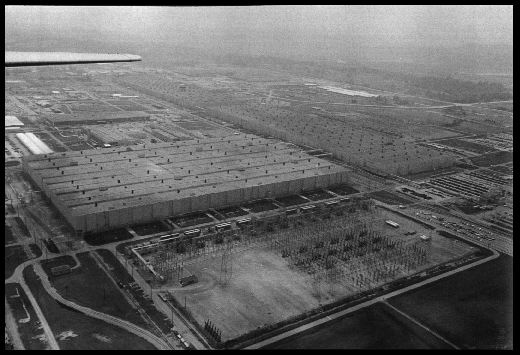 Portsmouth Gaseous Diffusion Plant
At the Portsmouth Gaseous Diffusion Plant, uranium gas is pumped through miles of pipe that filter the smaller, lighter uranium-235 atoms form uranium-238. U-235 sustains the nuclear chain reaction in reactors and in bombs. The three "process buildings" are among the largest industrial structures in the world; each is half a mile long; they operate around the clock and can together consume in a day as much electricity as the city of Memphis, Tennessee. Piketon, Ohio. July 27, 1983. 
Keywords: Portsmouth Gaseous Diffusion Plant Piketon, Ohio