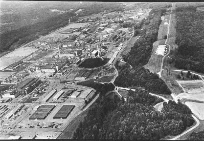 Oak Ridge Y-12
Converts enriched uranium compounds to metal and then casts, rolls, and machines it to extremely precise tolerances for bomb parts. Y-12 employs 7,200 people. Oak Ridge Reservation, Oak Ridge, Tennessee. August 10, 1983. 
Keywords: Oak Ridge Y-12 National Security Complex (NSC)