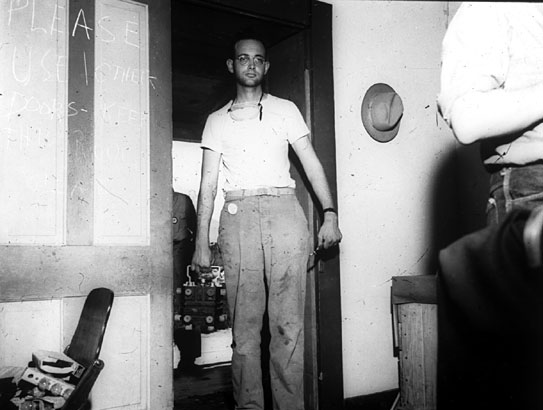 Plutonium Core
Sgt. Herbert Lehr delivering the plutonium core (or more probably half of it) for the Gadget in its shock-mounted carrying case to the assembly room in the McDonald Ranch farmhouse. 
