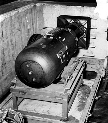 Little Boy Bomb
The Little Boy bomb in the bomb pit, ready for loading into the Enola Gay.

In essence, the Little Boy design consisted of a gun that fired one mass of uranium 235 at another mass of uranium 235, thus creating a supercritical mass. A crucial requirement was that the pieces be brought together in a time shorter than the time between spontaneous fissions. Once the two pieces of uranium are brought together, the initiator introduces a burst of neutrons and the chain reaction begins.
