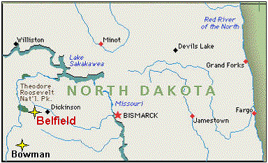 The Belfield facility site is located about one mile southeast of the town of Belfield in Stark County, North Dakota.
Union Carbide Corporation (UCC) built and operated the facility in the early 1960s to burn uraniferous lignite coal. The plant had a capacity of 100 tons of ore per day and was operated from July 1965 to November 1967. The plant site was located near the mines to decrease the freight haulage costs. Burning the lignite concentrated the uranium values in the ash product that was directly amenable to further processing at the companys Rifle, Colorado, uranium mill. The raw lignite ore, which contained 35-50 percent moisture by weight, was burned in a natural gas fired, rotary kiln to decompose and drive off the organic constituents and carbon. The kiln was 8 feet in diameter by 125 feet in length, and it operated at 1,300F to 1,600F depending on the lignite feed quality. The lignite ore averaged about 0.37 percent U3O8, and the uranium values were concentrated in the ash by the burning process. Uranium recovery in the ash product averaged 93 percent.
