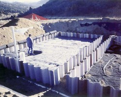 Durango, Colorado  Personnel from Sandia National Laboratories in New Mexico installed four PRBs at the Durango, Colorado, Uranium Mill Tailings Radiation Control Act Title I site in October 1995. These PRBs are managed by DOE Legacy Management. Foamed zero-valent iron bricks produced by Cercona of America, steel wool, and granular iron have been used as reactive media to remove ammonium, arsenic, cadmium, chromium, manganese, molybdenum, nitrate, radium-226, selenium, uranium, vanadium, and zinc contamination from leachate exiting the uranium mill tailings disposal cell. After passing through the zero-valent iron, the leachate contaminant levels meet the regulatory standards.
