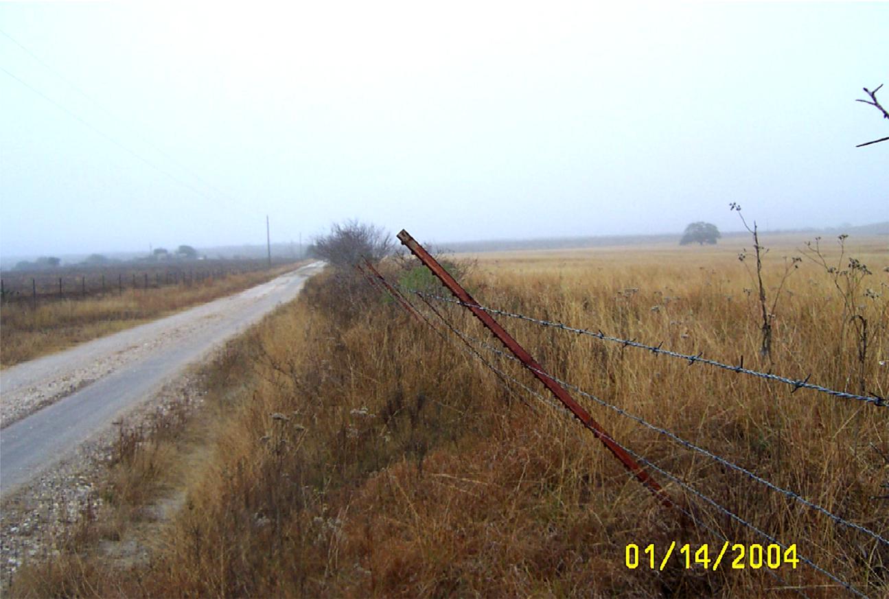 Section of Falls City perimeter fence leaning outward, located near perimeter sign P38 along
