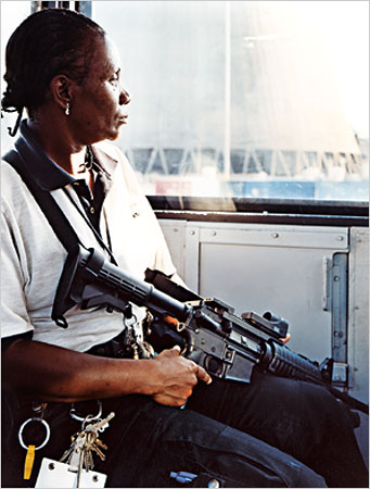 Grand Gulf BRE
On Guard: A security guard at her post inside a B.R.E. (bullet-resistant enclosure) at the Grand Gulf nuclear plant. Armed guards patrol the interior corridors of the plant as well.
Keywords: Grand_Gulf BRE