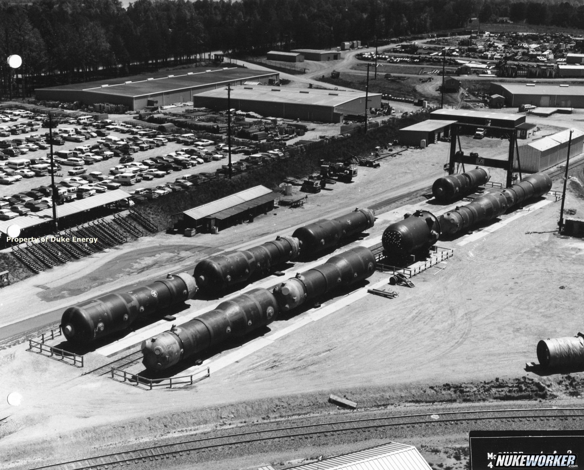 Click to view full size image
==============
McGuire Nuclear Station
On Oct. 4, 1974, the first of four unit 1 steam generators was delivered to McGuire and additional generators followed. Each steam generator weights 376 tons and is nearly 68 feet in length. The steam generators are U-shaped heat exchangers – each steam generator contains approximately 45 miles of tubing.
McGuire Nuclear Station
On Oct. 4, 1974, the first of four unit 1 steam generators was delivered to McGuire and additional generators followed. Each steam generator weights 376 tons and is nearly 68 feet in length. The steam generators are U-shaped heat exchangers – each steam generator contains approximately 45 miles of tubing.