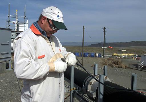 Tank Farms
Steve Bolt repairs an electrical cord at the "tank farms" on the Hanford Nuclear Reservation near Richland, Wash., on Tuesday, March 23, 2004. Bolt and more than 800 others who work at the tank farms, where about 53 million gallons of radioactive waste is stored in 177 underground tanks, are given the option of wearing respirators depending on the location and nature of their work.
Keywords: Hanford Reservation, Richland, Washington