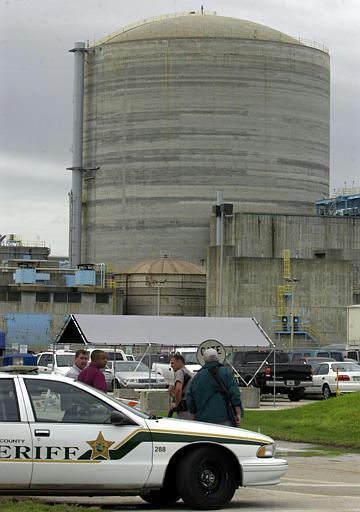 St. Lucie County Nuclear Power Plant
Armed guards and a St. Lucie County Sheriff's Deputy man a post at the entrance to the St. Lucie County Nuclear Power Plant on South Hutchinson Island in St. Lucie County, Fla. on Wednesday Oct. 31, 2001. Added security measures which include a 10 nautical mile no fly zone around nuclear power plants will be in effect until at least Nov. 7.
Keywords: St. Lucie County Nuclear Power Plant