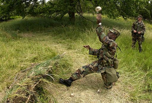 Wolf Creek Nuclear Power Plant
Kansas National Guard Sgt. Maj. Joel Davis throws a dummy hand grenade during a training exercise at the Wolf Creek nuclear power plant in Burlington, Kan., Tuesday, June 8, 2004. Members of the 130th Field Artillery Brigade and the 1st Battalion, 127th Field Artillery were training to respond to acts of terrorisim or other emergencies at the plant.
Keywords: Wolf Creek Nuclear Power Plant