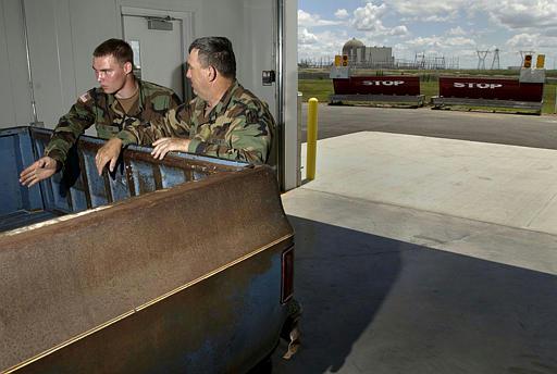 Wolf Creek Nuclear Power Plant
Kansas National Guard Pfc. Carl Sutton, right, and Sgt. Charlie Cox talk about vehicle searches during a training exercise at the Wolf Creek nuclear power plant in Burlington, Kan., Tuesday, June 8, 2004. Members of the 130th Field Artillery Brigade and the 1st Battalion, 127th Field Artillery were training to respond to acts of terrorisim or other emergencies at the plant.
Keywords: Wolf Creek Nuclear Power Plant