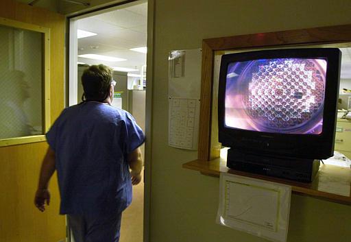 Duane Arnold Nuclear Power Plant
A Duane Arnold Energy Center worker walks past a monitor with a view of the nuclear reactor's core at the Duane Arnold Energy Center near Palo, Iowa, April 7, 2003. The majority owner of Iowa's only nuclear power plant announced Wednesday, Dec. 22, 2004, that it plans to sell its stake in the Duane Arnold Energy Center. Iowa Power and Light Co., a subsidiary of Madison, Wis.-based Alliant Energy Corp., owns 70 percent of the plant.
Keywords: Duane Arnold Nuclear Power Plant