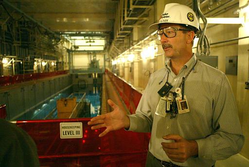 Catawba Nuclear Power Station
Mike Glover, station manager at the Duke Catawba Nuclear Power Station, stands above the spent fuel pool at the plant near York, S.C., Monday, Oct. 11, 2004. Used uranium is cooled and stored in the pool. The concrete moat under construction at the station south of Charlotte has little to do with the utility's plans to start burning mixed-oxide fuel containing small amounts of weapons-grade plutonium next spring.
Keywords: Catawba Nuclear Power Plant