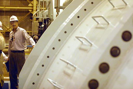 Catawba Nuclear Power Station
Mike Glover, station manager at the Duke Catawba Nuclear Power Station, stands by a large turbine on the turbine floor at the nuclear plant near York, S.C., Monday, Oct. 11, 2004. The concrete moat under construction at the station south of Charlotte has little to do with the utility's plans to start burning mixed-oxide fuel containing small amounts of weapons-grade plutonium next spring. Designed to prevent everything from passenger cars to military tanks from getting too close to the reactor.
Keywords: Catawba Nuclear Power Plant