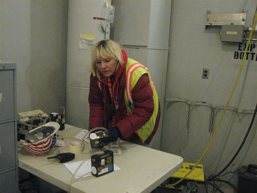 Debbie
Preparing the lapel air samplers for personnel expected to enter an ARA/MRA.  Those of you not familiar with our jargon, an ARA is an Airbourne Radioactivity Area and the MRA is for a 'Mitch's Radiological Area'.  We post those anyway Mitch thinks there might be 'spiders' waiting to bite him.
