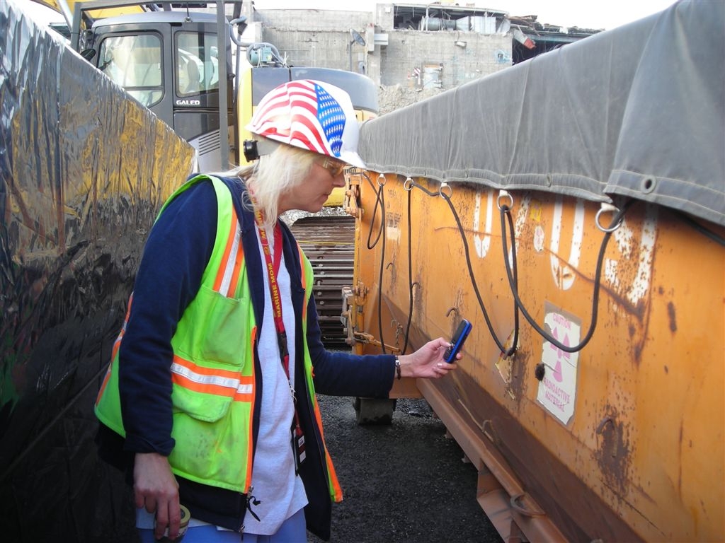 Debbie zooms in
using her phone, gets a pic of the small bat hanging from loose paint on the side of the ERDF box, 105N loadout.
