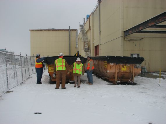 waste load out into boxes for burial at ERDF
Left to right...  Steve, Jeff, Marie and Brand
