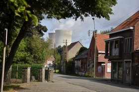 Doel village street with cooling tower behind